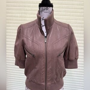 Genuine leather women’s cropped jacket with short sleeves